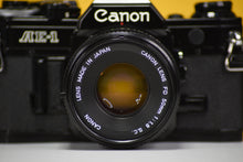 Load image into Gallery viewer, Canon AE-1 Black Vintage 35 Film Camera With 50mm F/1.8 Prime Lens
