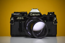 Load image into Gallery viewer, Canon AE-1 Black Vintage 35 Film Camera With 50mm F/1.8 Prime Lens
