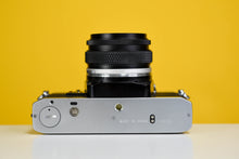 Load image into Gallery viewer, Olympus Om10 Slr Vintage 35mm Film Camera with Zuiko 50mm f1.8 Prime Lens, Lens Filter, Strap and Olympus Manual Adapter
