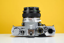 Load image into Gallery viewer, Olympus OM1 MD 35mm Film Camera with Zuiko 50mm f/1.8 Prime Lens
