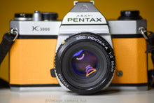 Load image into Gallery viewer, Pentax K1000 Film Camera with Pentax 50mm f/1.7 Lens in Yellow
