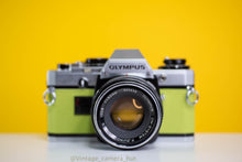 Load image into Gallery viewer, Olympus OM10 Slr Vintage 35mm Film Camera with Zuiko 50mm f1.8 Prime Lens Reconditioned With New Lime Leather Skin
