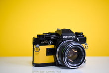 Load image into Gallery viewer, Olympus OM10 SLR Black Vintage 35mm Film Camera with Zuiko 50mm f/1.8 Prime Lens New Leather Yellow Skin
