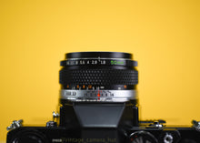 Load image into Gallery viewer, Olympus OM10 SLR Black Vintage 35mm Film Camera with Zuiko 50mm f/1.8 Prime Lens New Leather Yellow Skin
