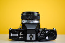 Load image into Gallery viewer, Olympus OM10 SLR Black Vintage 35mm Film Camera with Zuiko 50mm f/1.8 Prime Lens New Leather Yellow Skin
