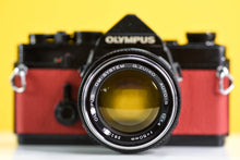 Load image into Gallery viewer, Olympus OM-1 Black Vintage 35mm Film Camera with Zuiko 50mm f/1.4 Lens New Orange Leather Skin
