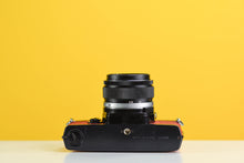 Load image into Gallery viewer, Olympus OM-1 Black Vintage 35mm Film Camera with Zuiko 50mm f/1.4 Lens New Orange Leather Skin
