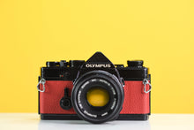 Load image into Gallery viewer, Olympus OM-1 Black 35mm Film Camera with Zuiko 50mm f/1.8 Prime Lens Red Leather Skin
