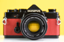 Load image into Gallery viewer, Olympus OM-1 Black 35mm Film Camera with Zuiko 50mm f/1.8 Prime Lens Red Leather Skin
