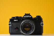 Load image into Gallery viewer, Olympus OM4 35mm Film Camera with Zuiko 50mm f1.8 Prime Lens
