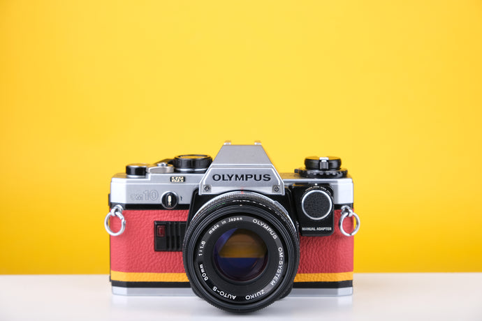 Olympus OM10 Slr Vintage 35mm Film Camera with Zuiko 50mm f1.8 Prime Lens  and Manual Adapter With New Leather Red and Yellow Skin