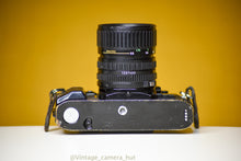 Load image into Gallery viewer, Canon A-1 Vintage 35mm Film Camera with Canon Zoom Lens FD 35-70mm f/3.5 with Lens Filter Cap
