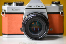 Load image into Gallery viewer, Pentax K1000 35mm Film Camera with SMC-M 50mm f/1.7 Prime Lens in Orange
