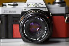 Load image into Gallery viewer, Minolta X-300 Vintage 35mm Film Camera with MInolta MD 45mm f/2 Prime Lens Reconditioned with New Red Skin
